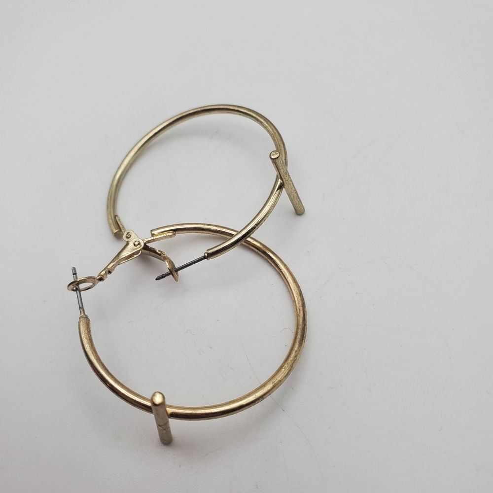 T round hoop earrings gold toned